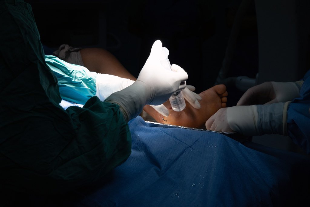 Surgeons in operating room with equipment